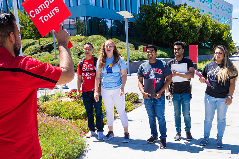 Tour guide showing students the CSUEB Hayward campus