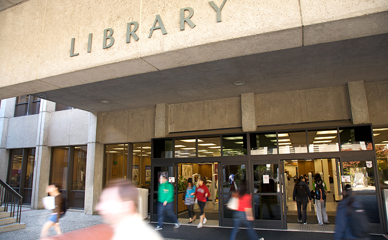 Front of the busy library with people coming and going