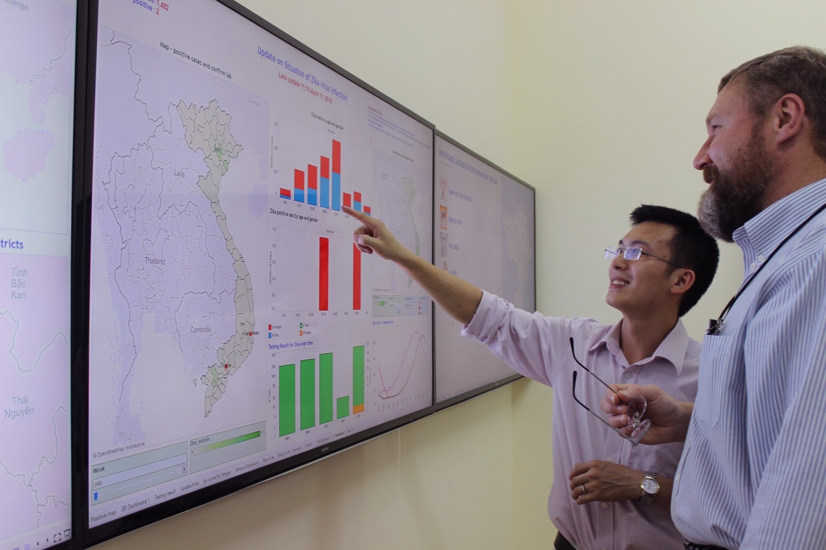 Researchers looking at map of epidemic in Vietnam