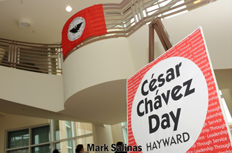 Hayward City Hall rotunda with a sign for the Cesar Chavez Day Teach-In.