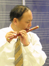 Tao Geng performs on the bamboo flute.