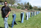 Artist, followed by row of jeans without bodies.