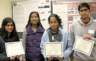 four high school students holding certificates
