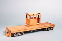 old, wooden, flatbed rail car.