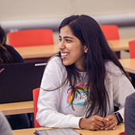 A young women smiles in class