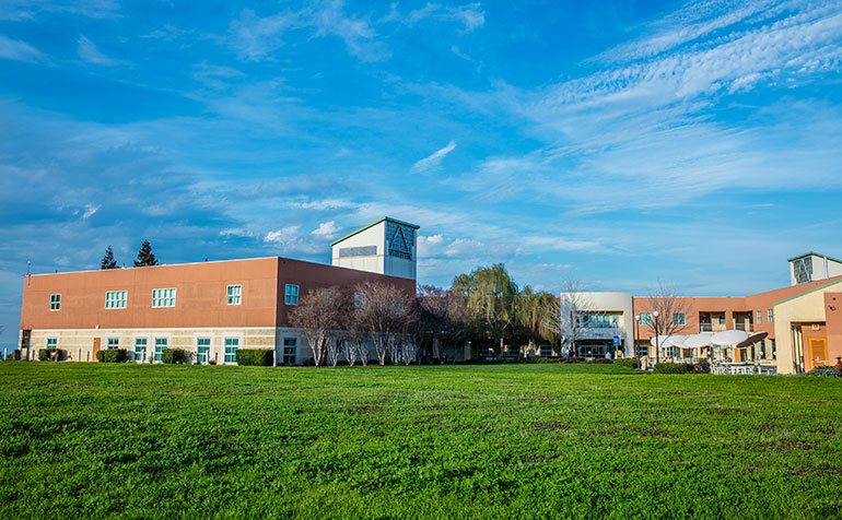 Concord campus buildings in front of blue sky