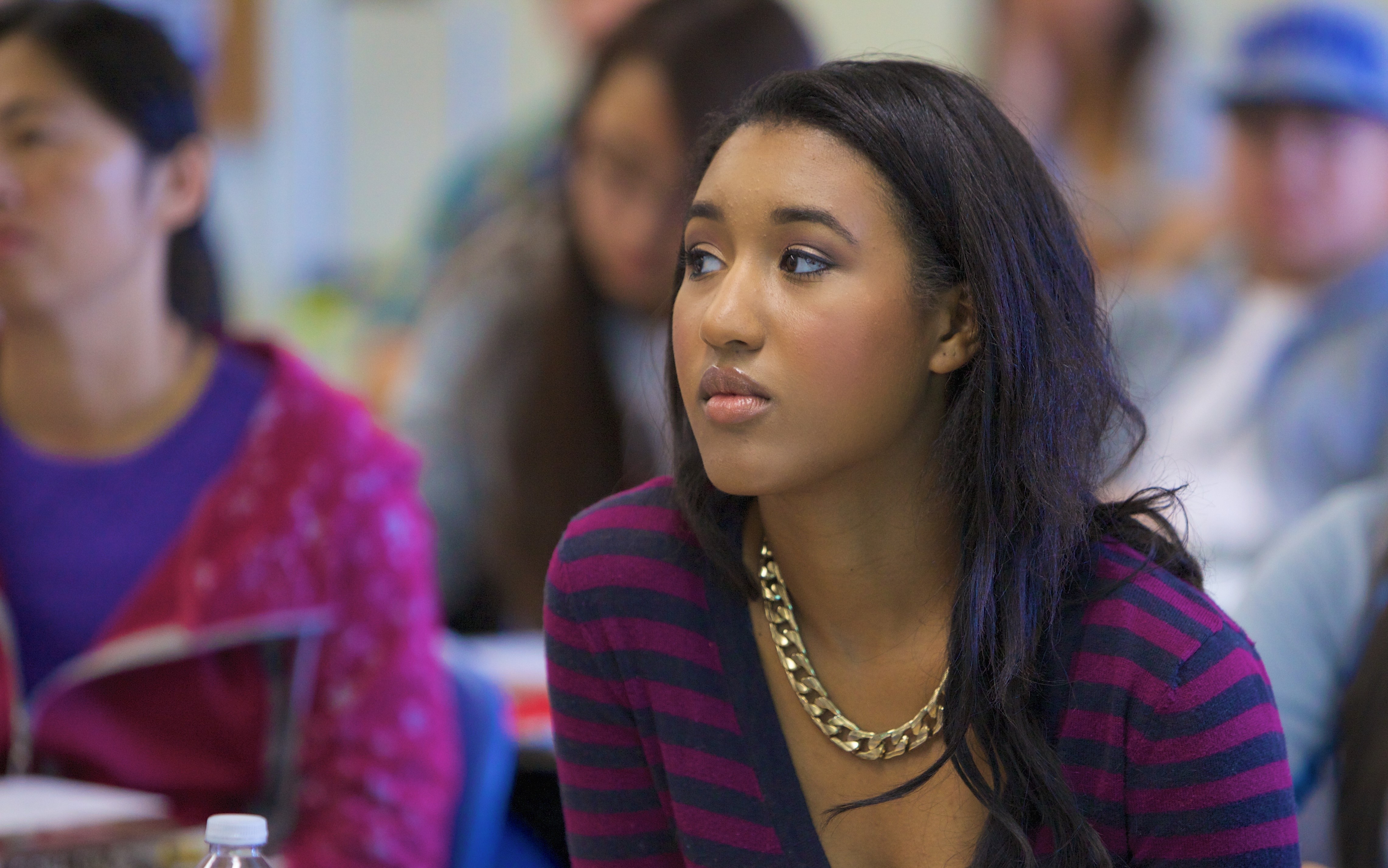 Student Focusing on Lecturer in a Classroom