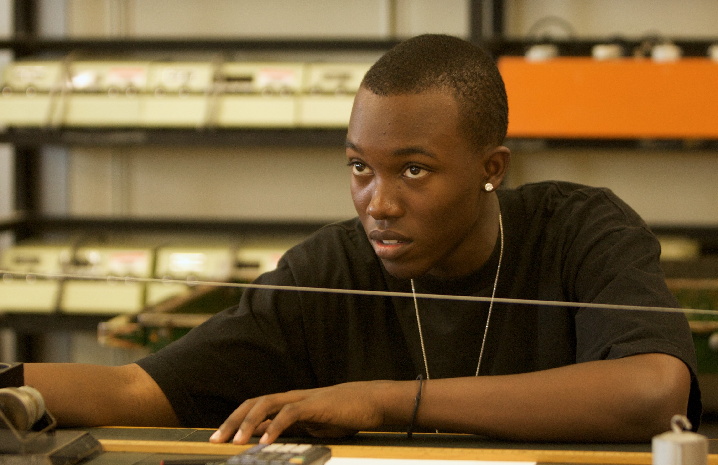 Student Looking at the Front of the Lab Classroom