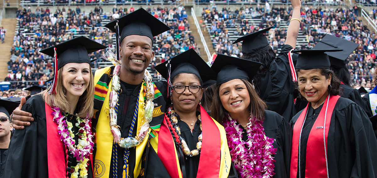 Students pose at graduation