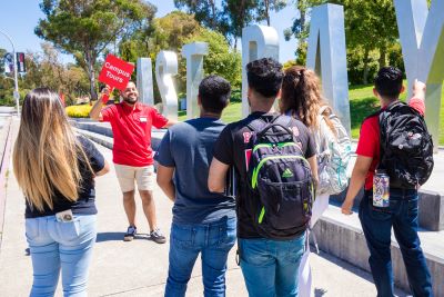 Tour guide talking to students at the Hayward campus