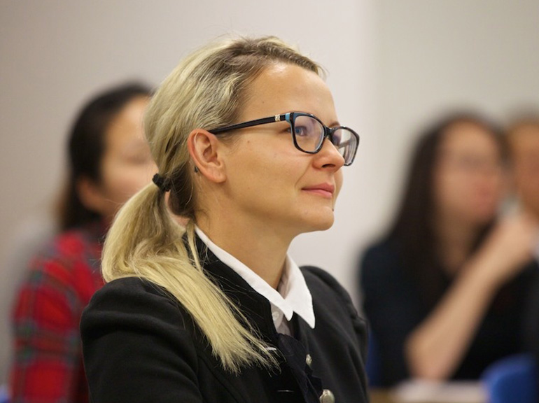 Female student engaged in classroom lecture