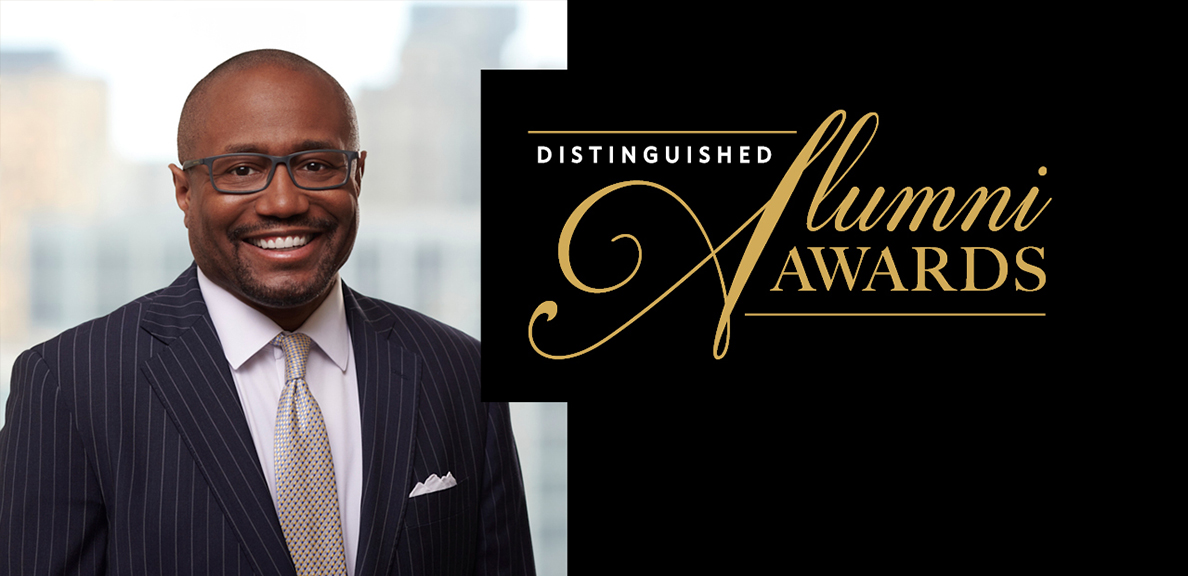 Aristide Collins Jr. Standing infront of a building