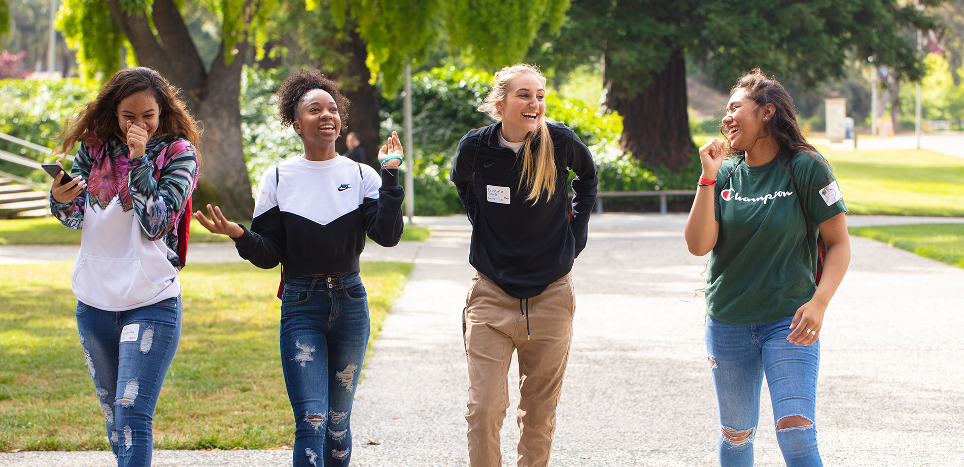 Four students laughing
