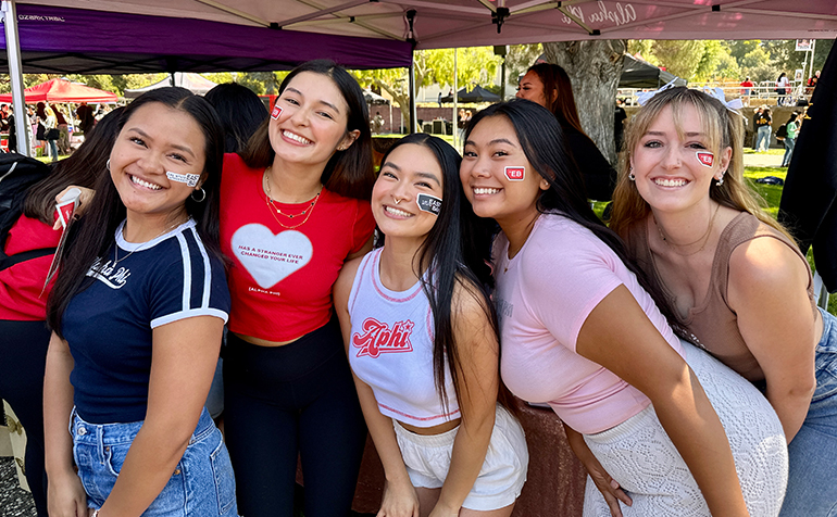 Five students with CSUEB stickers