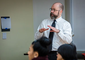 male teacher teaching a class