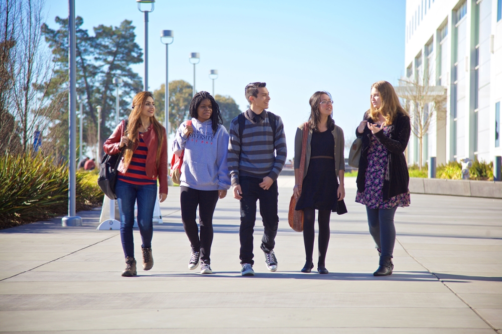  diverse students walking side by side