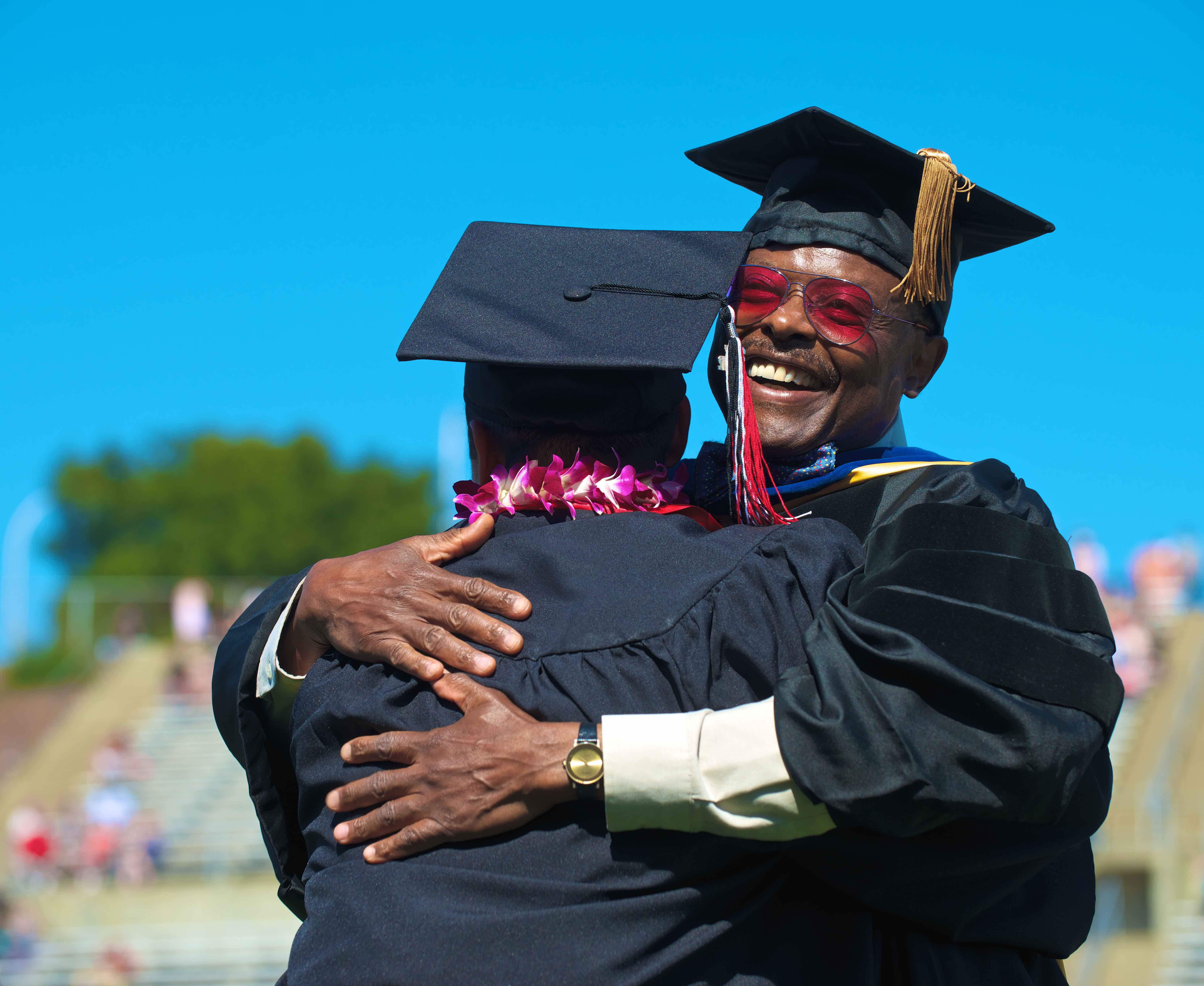 Two men embracing during graduation