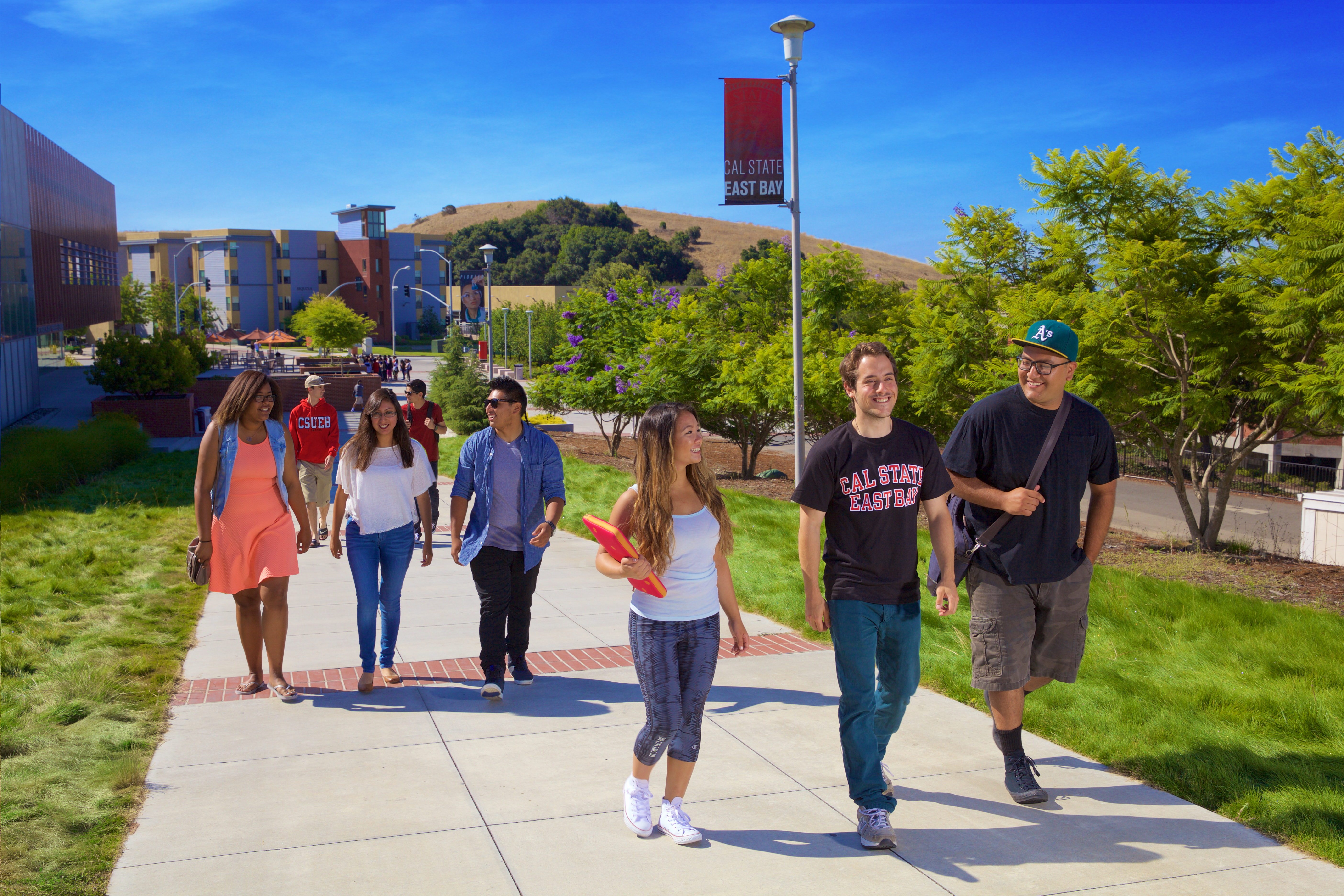 students walking in front of the Recreation and Wellness Center (RAW)