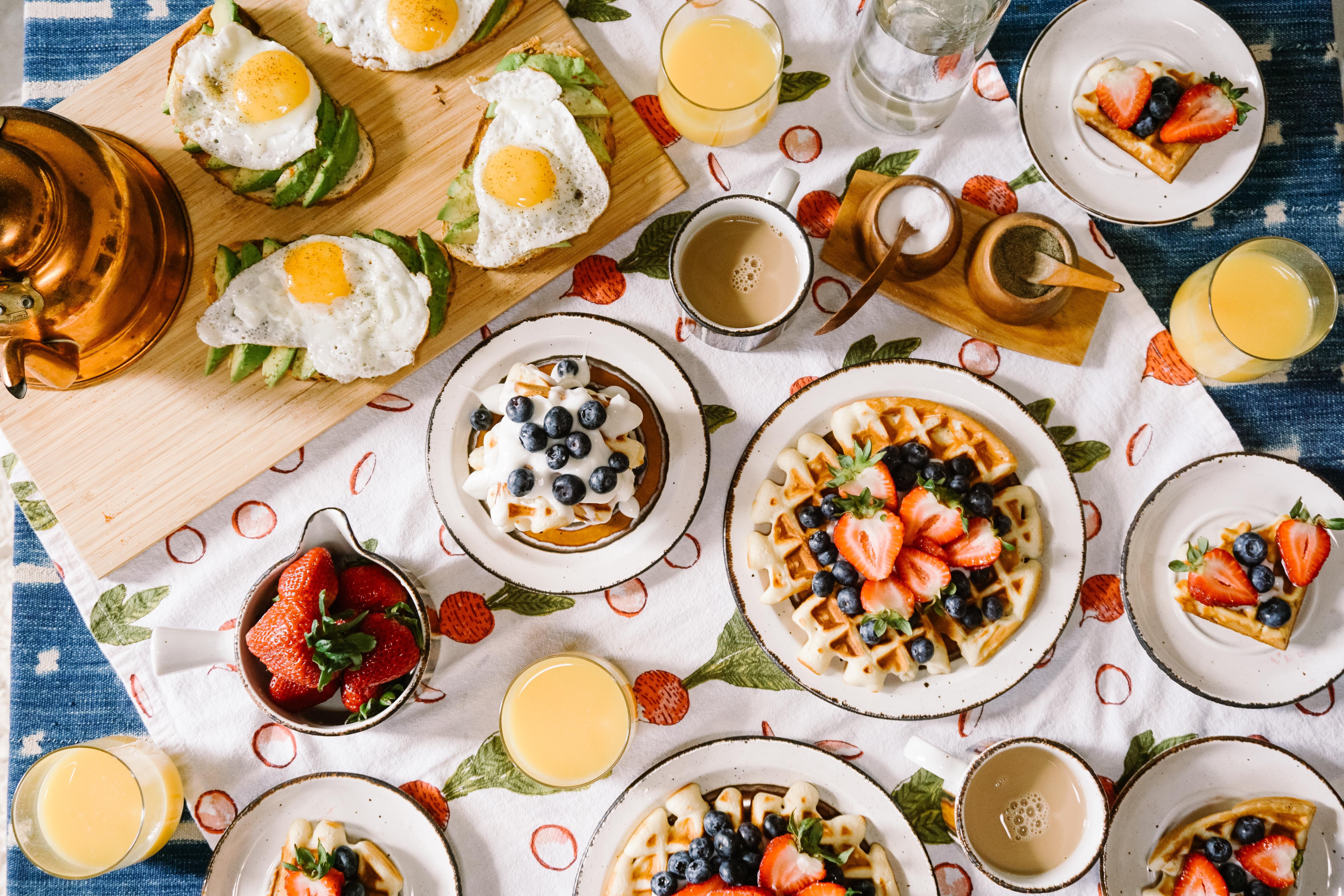 table with a variety of breakfast foods laid out