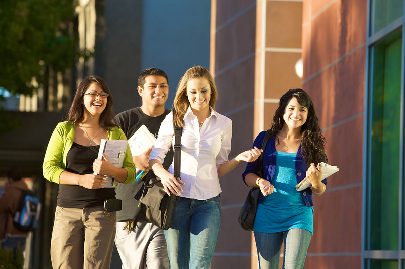 students walking out building