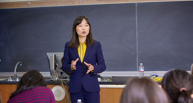 woman in a suit teaching