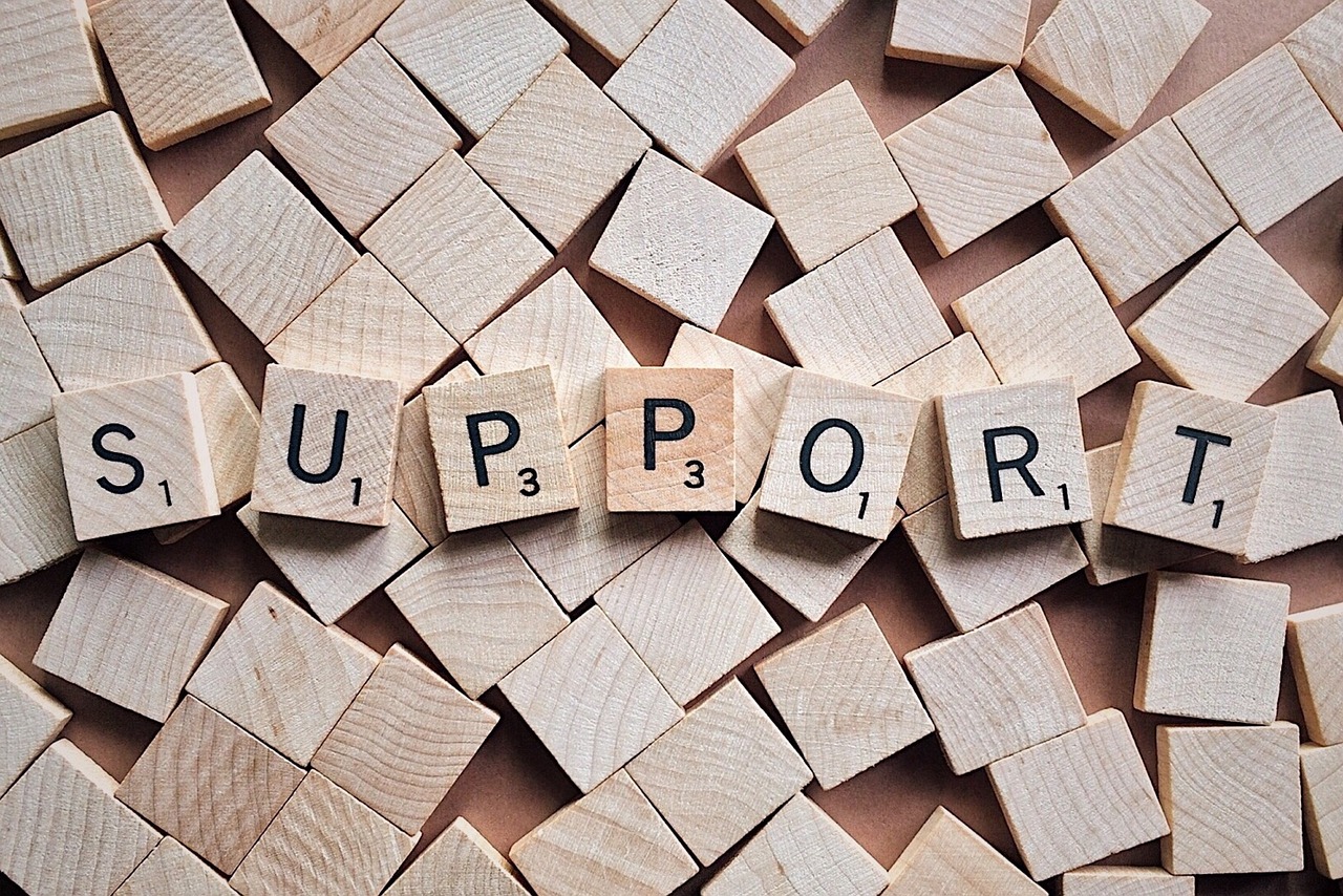 Scrabble tiles spelling the word Support