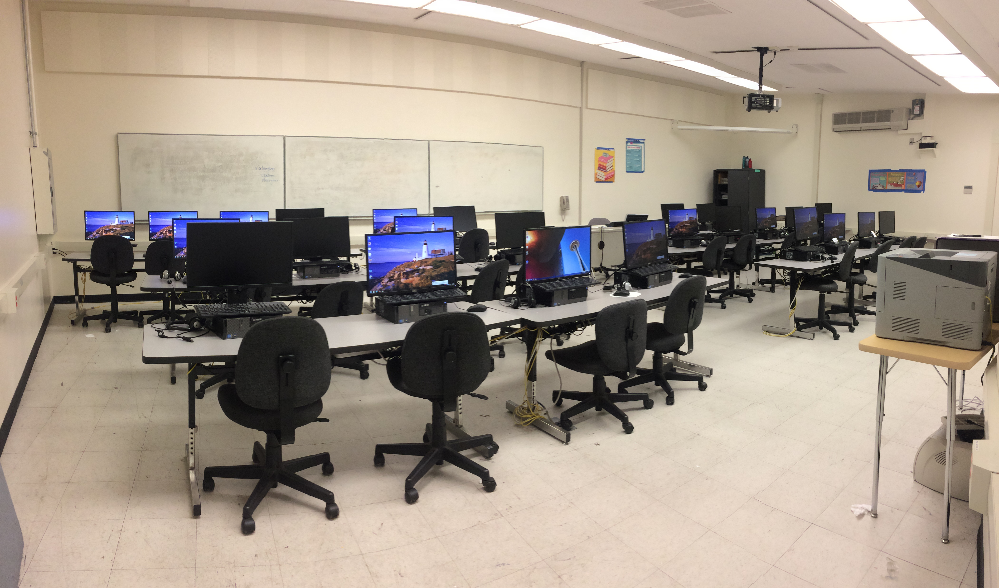 Computers lined with chairs in the lab