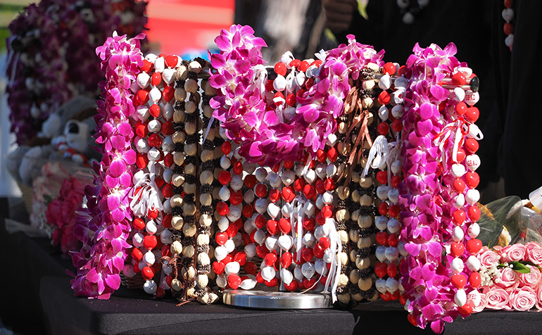 Stand with flowers, leis, and gifts