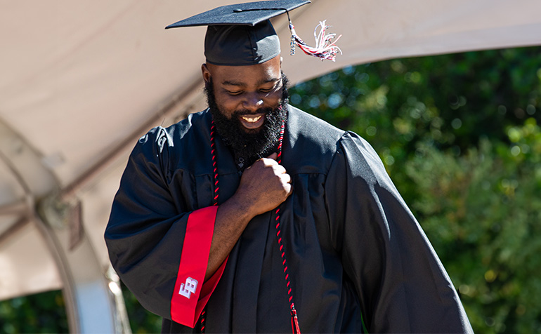 Graduate wearing academic regalia