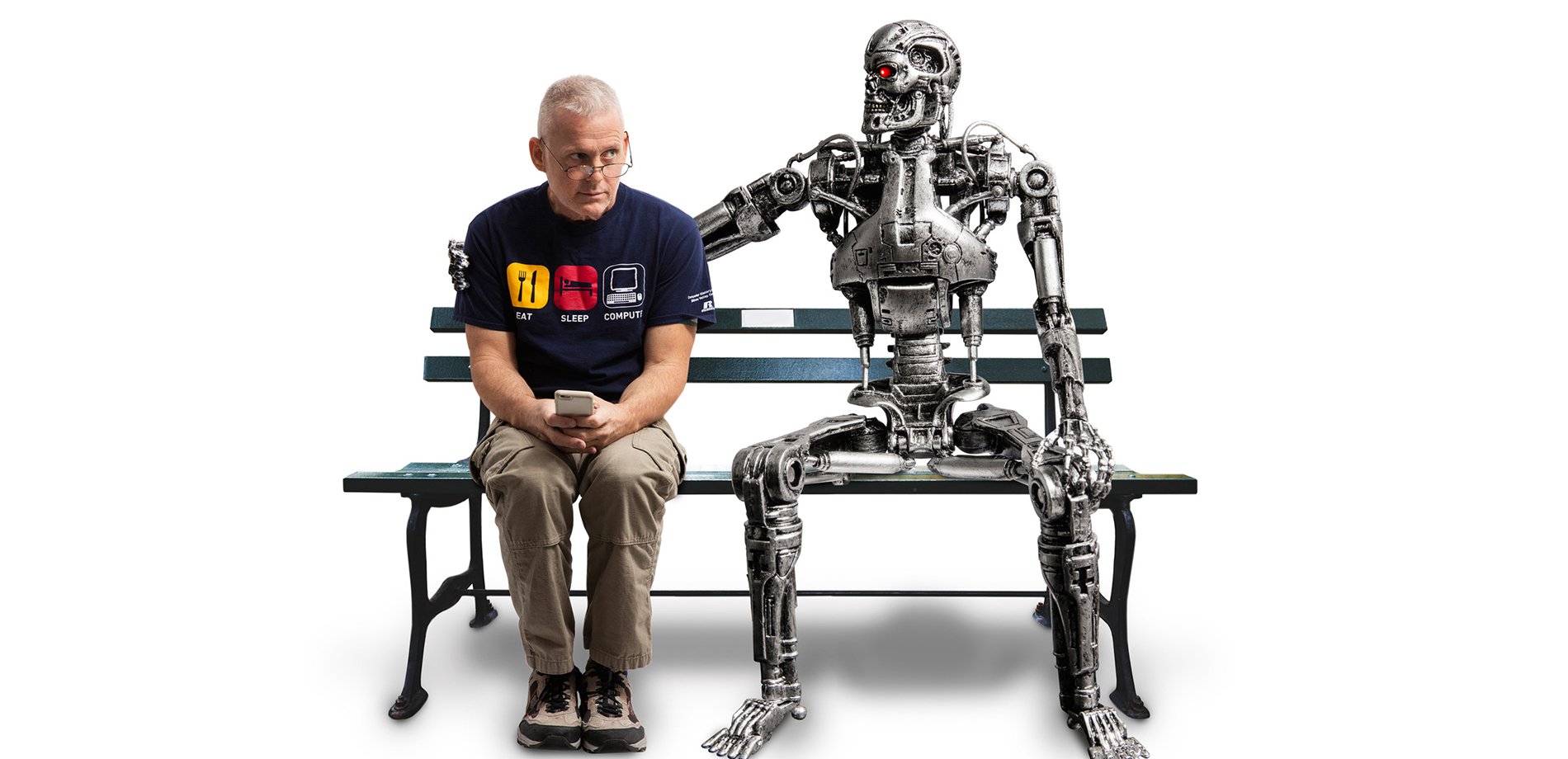 Dr. Matt Johnson sitting on a bench with a T-850 Terminator