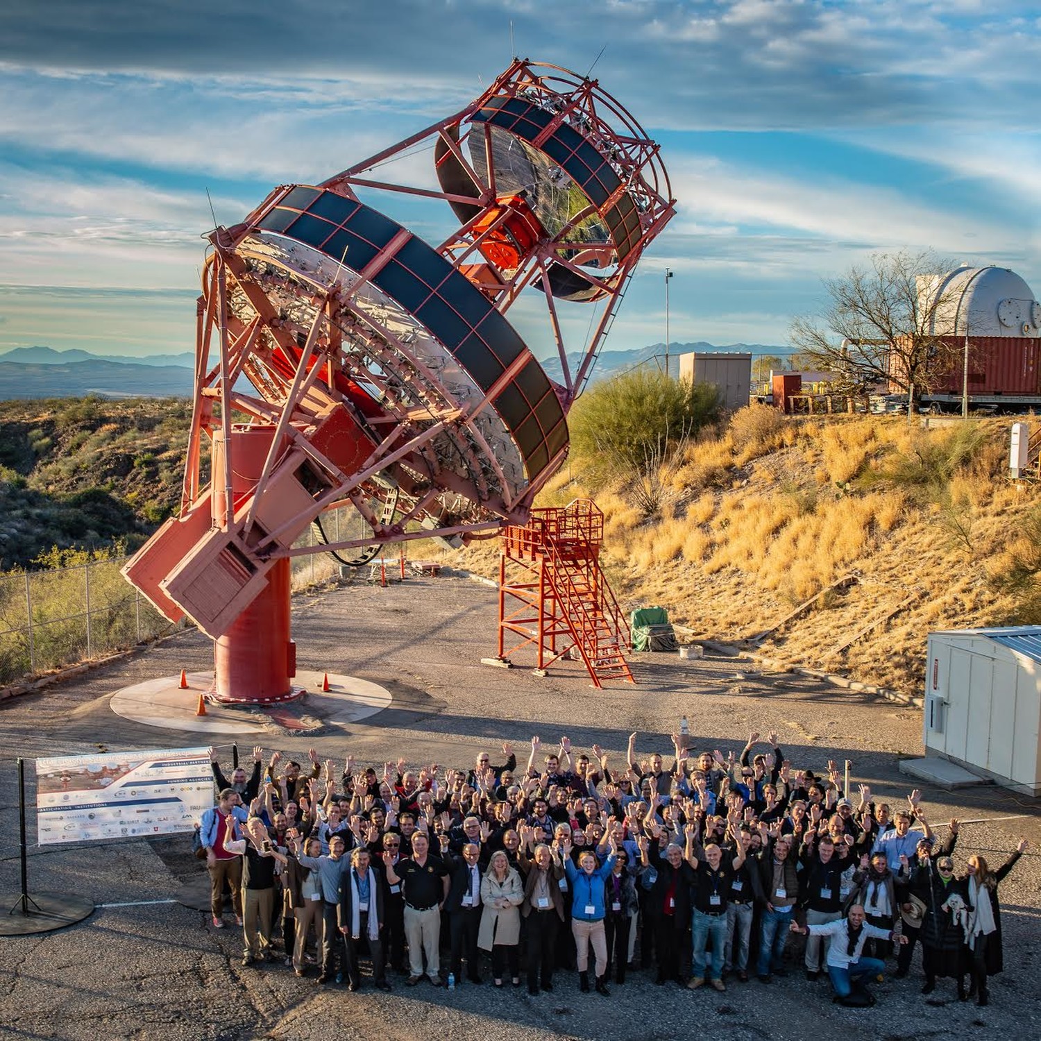Cal State East Bay Assistant Professor of Physics and gamma-ray astrophysicist Amy Furniss and others standing in front of the prototype gamma-ray telescope