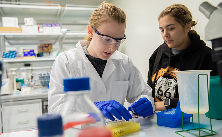 Two females students working in science lab