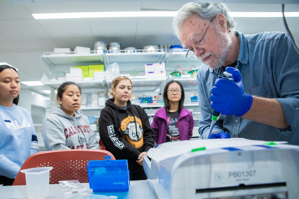 Professor Chris Baysdorfer demonstrates a technique at the Cal State East Bay sequencing labs.