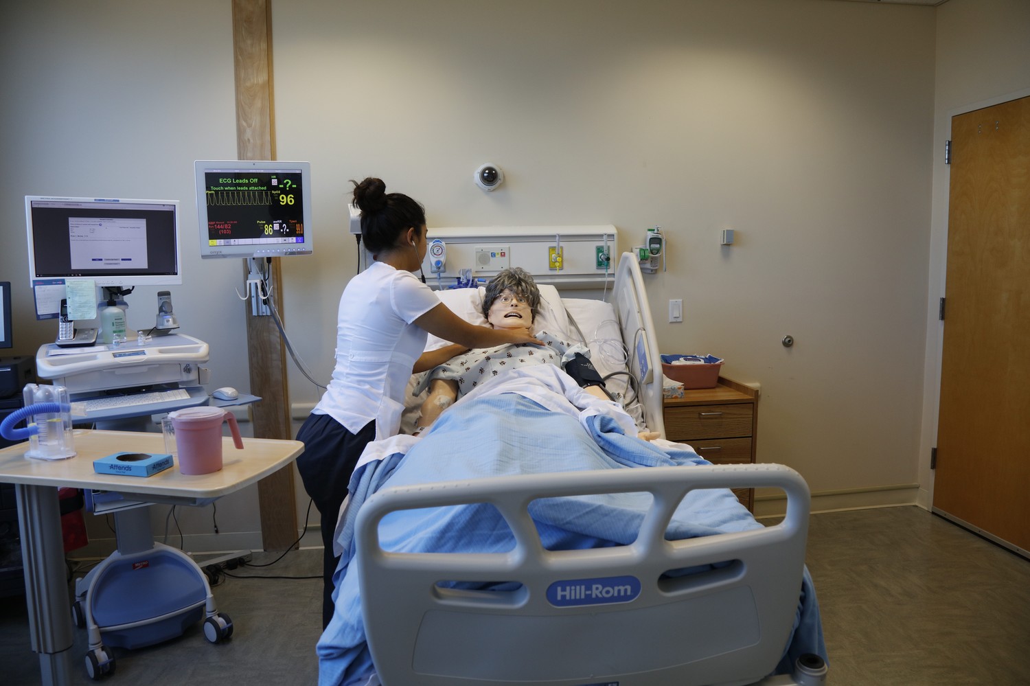 CSUEB nursing student practicing in the nursing skills lab