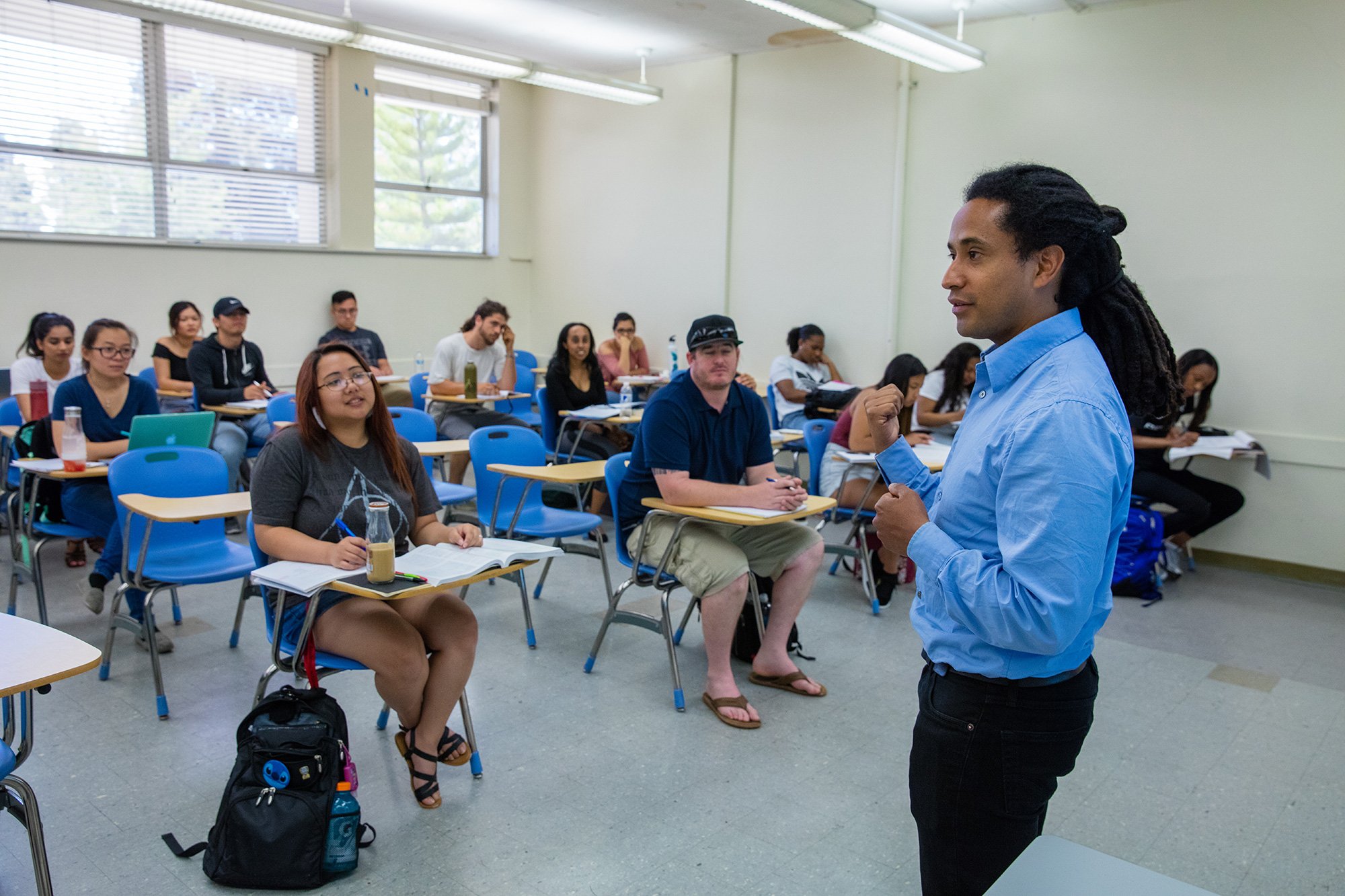 Dr. Stanton actively lecturing to a classroom with students