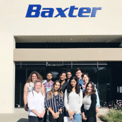 Group of 10 students standing and smiling for the camera