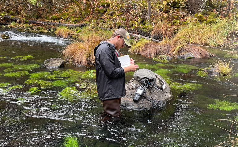 EESC Student conducting field work in a California stream