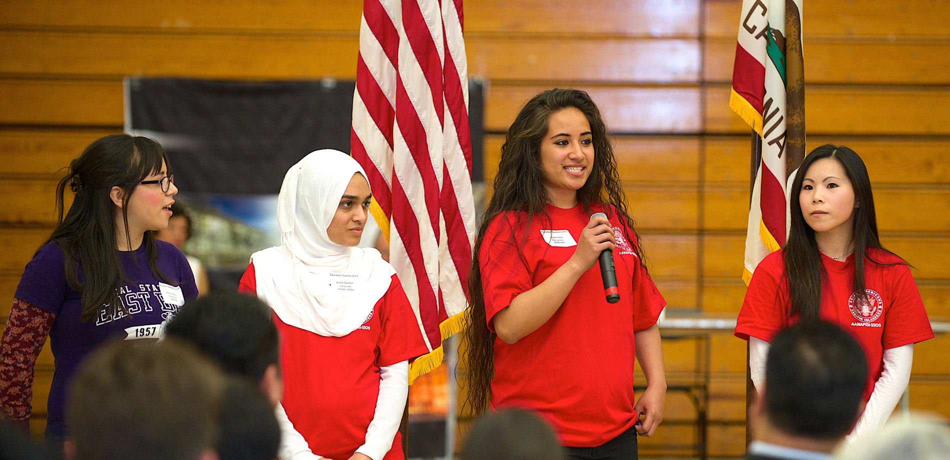 Four Students Giving a Speech