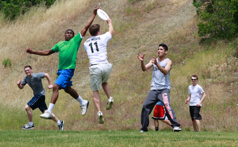 Students Playing Frisbee Football