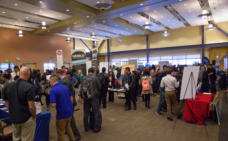 Students Viewing Booths at Job Fair