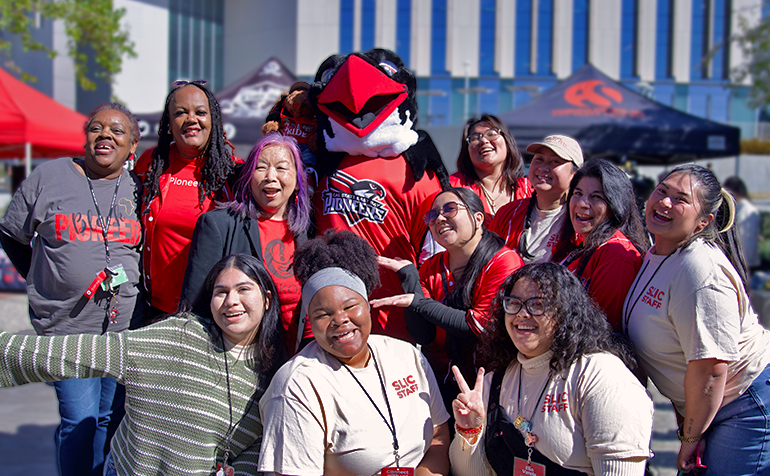 Group photo of Perry the Peregrine Falcon and staff from the Student Leadership and Involvement Center.