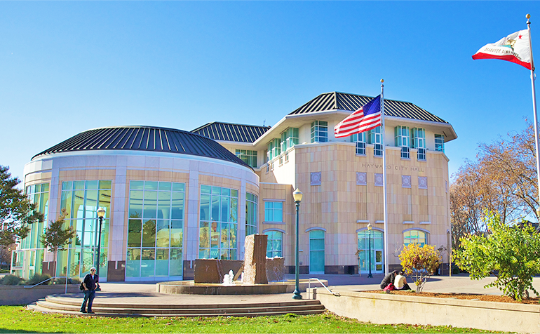 Outdoor view of Hayward City Hall building on a sunny day.
