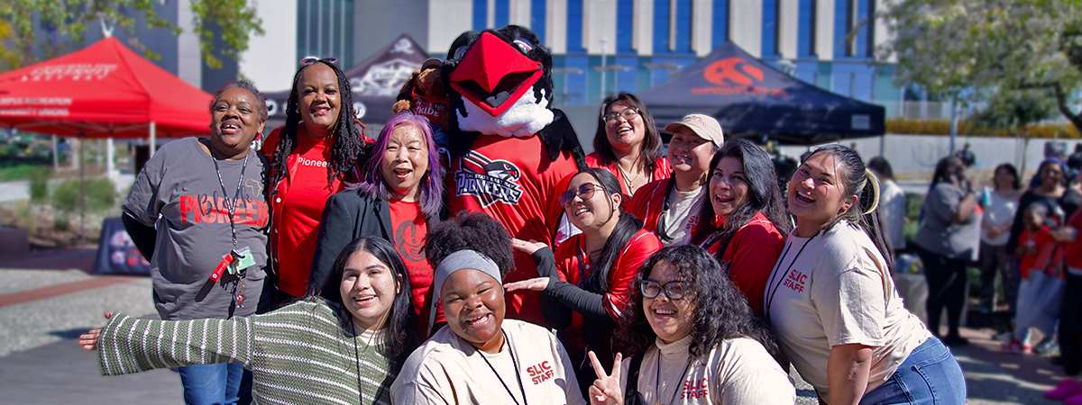 Perry the Peregrine Falcon in a group picture with Student Leadership & Involvement staff members