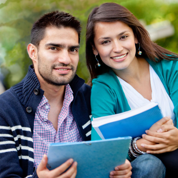 Two students with notebooks