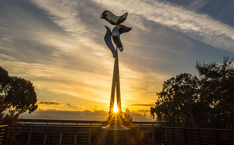 Emerging dimensions sculpture at sunset