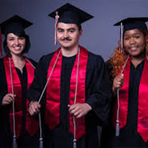 three students taking grad photos 