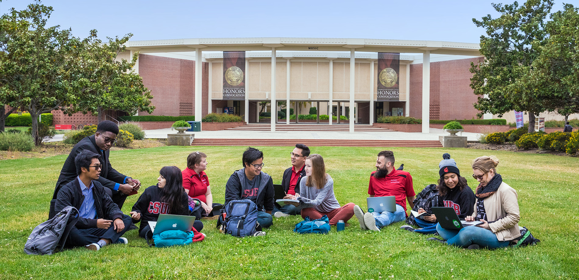 Students sitting on lawn
