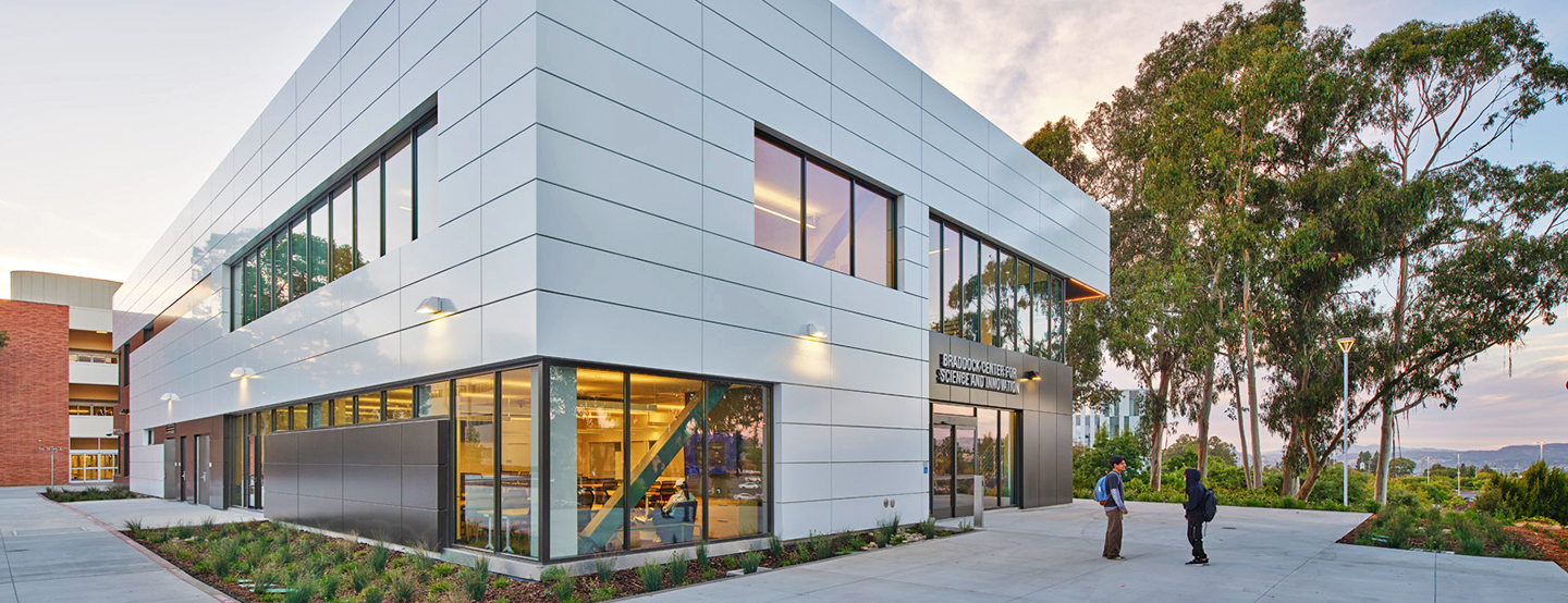 An angled, exterior view of the Braddock Center for Science and Innovation in the afternoon light