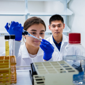 two students standing in lab 