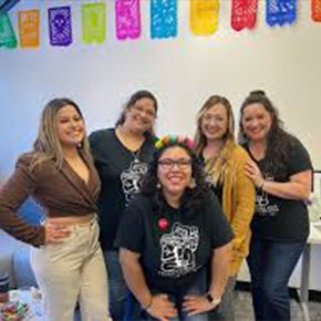 group of females standing inside 